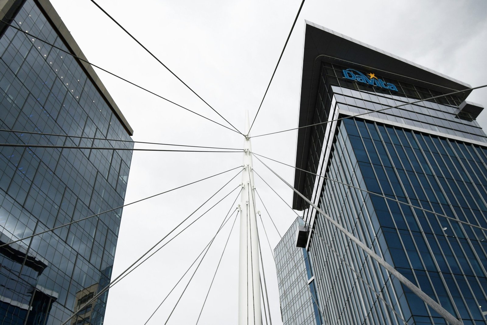 a view of two tall buildings from the ground